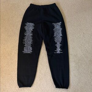 Black Sweatpants with Taylor Swift songs.